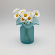 Aqua blue glass vase with ruffled crimped rim on cylindrical frosted base creating handkerchief or flower petal shape