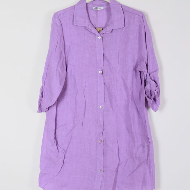 Lavender linen shirt dress with white button front, collar, rolled three-quarter sleeves, and relaxed tunic silhouette