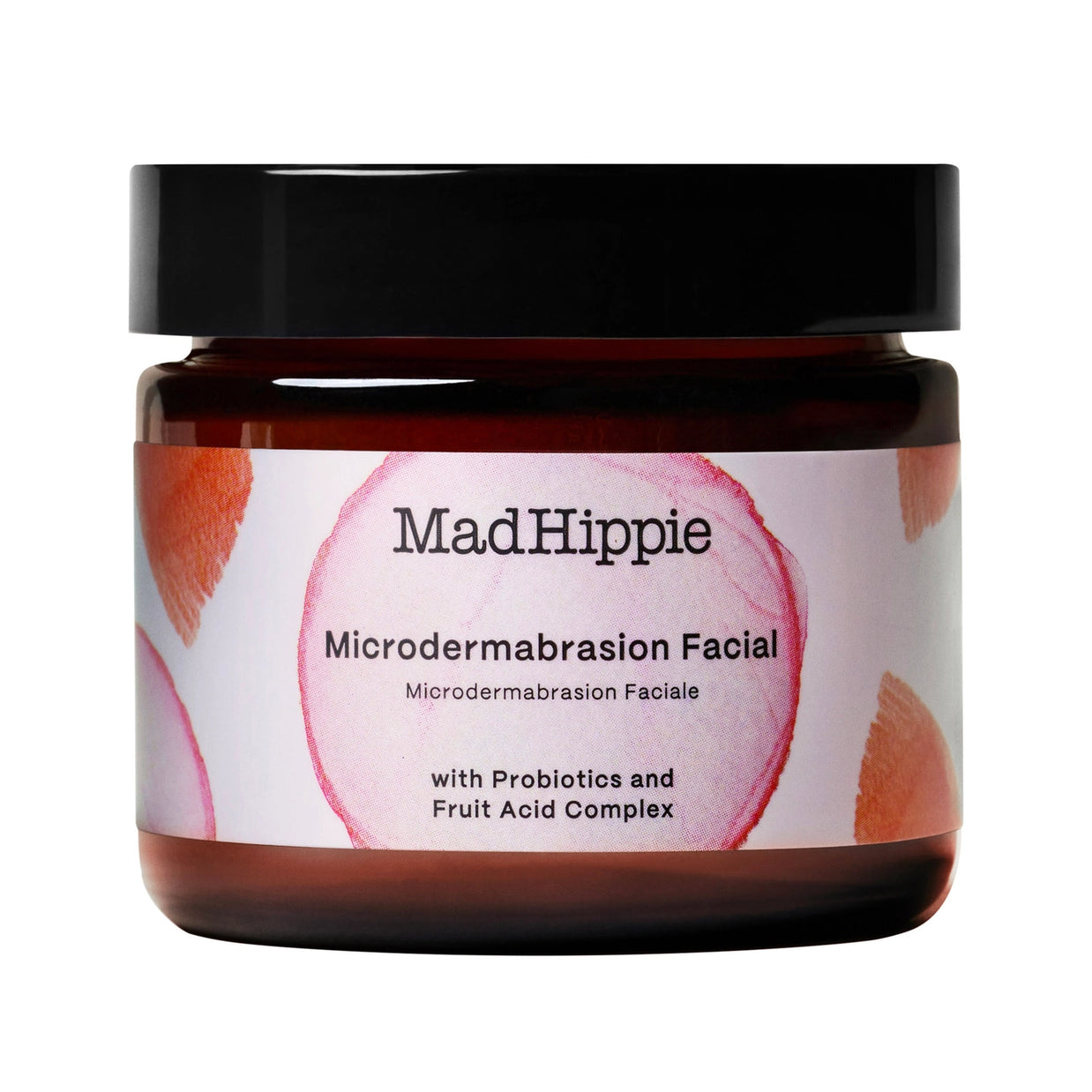Dark amber glass jar with black lid, MadHippie microdermabrasion facial scrub with pink and orange watercolor label design