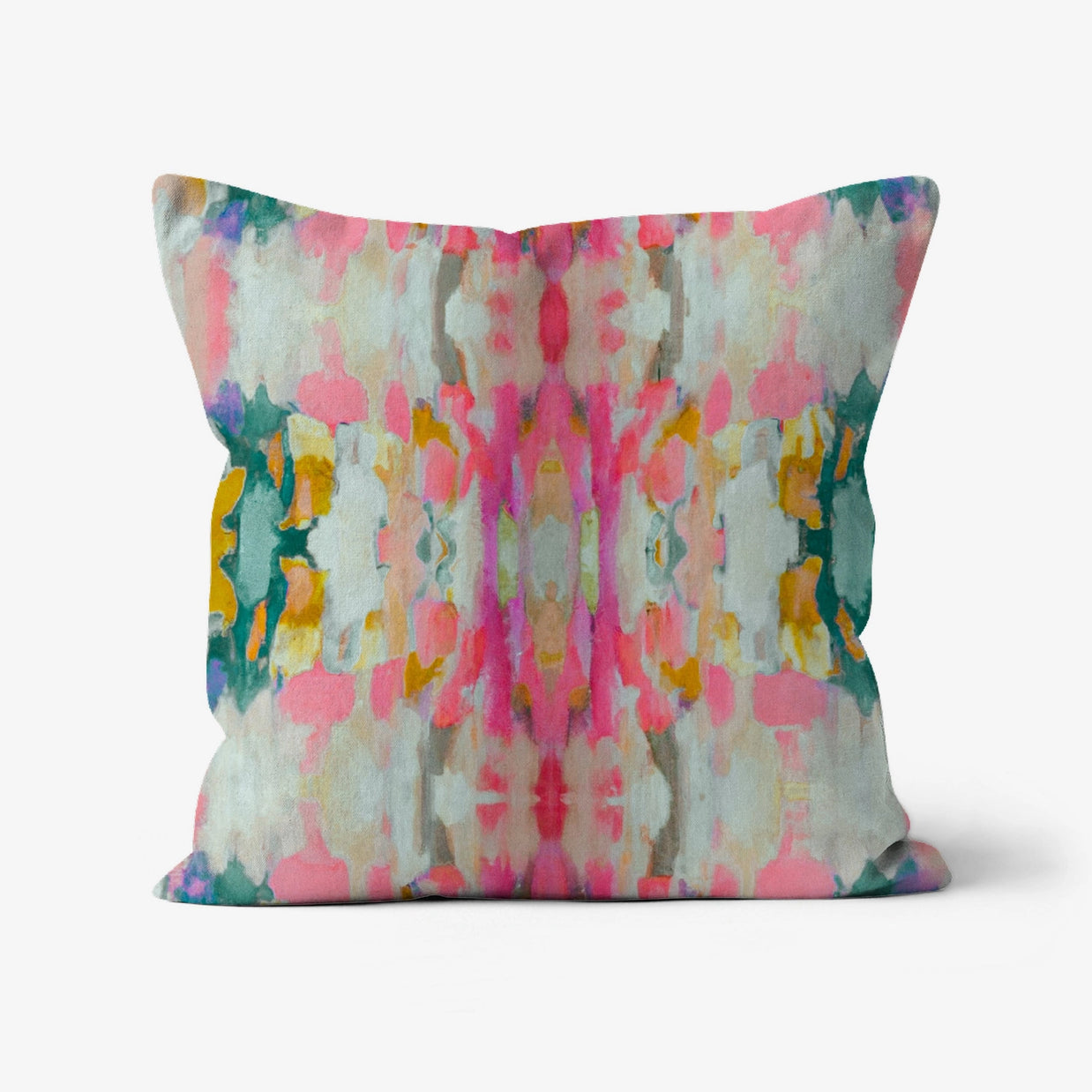 Square throw pillow with abstract watercolor pattern in pink, teal, mustard yellow, and cream with soft blurred brushstrokes