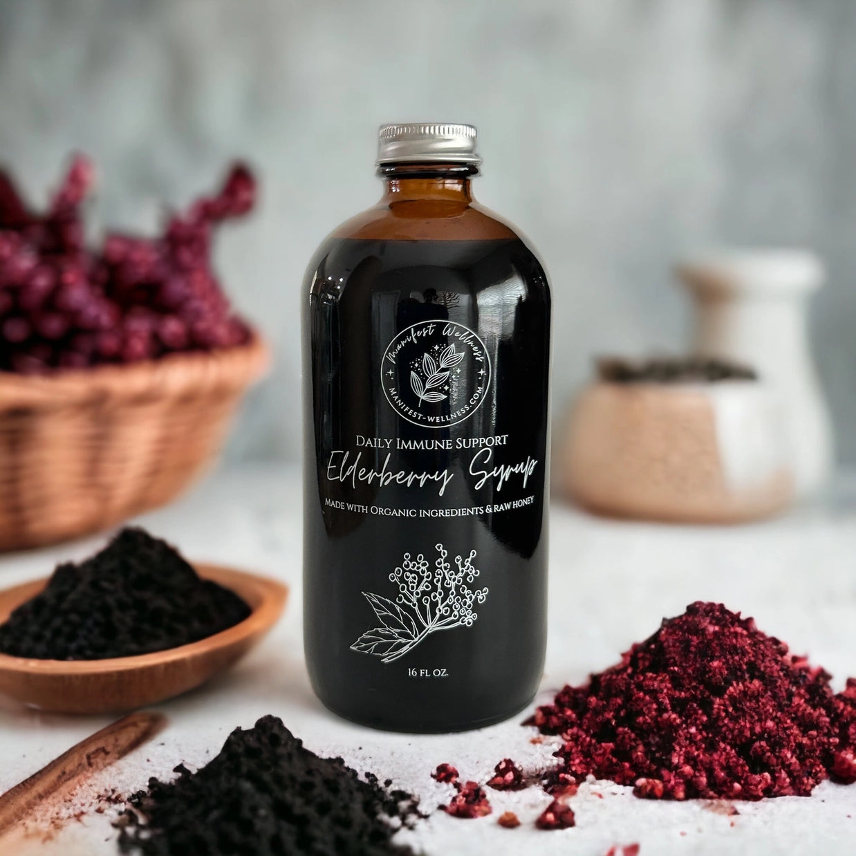 Bottle of Daily Immune Support Elderberry Syrup with ingredients on a table