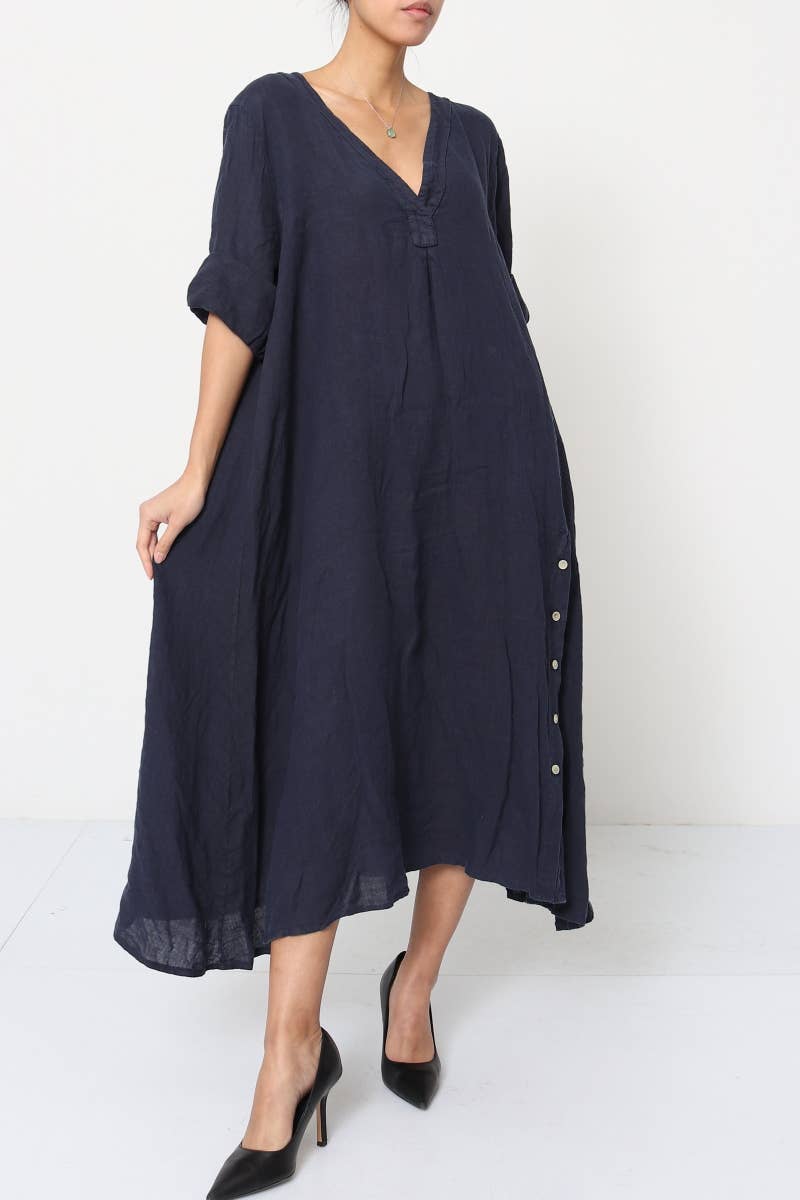 Navy blue linen midi dress with V-neck, rolled sleeves, white side buttons, loose A-line silhouette and flowing hem