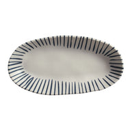 Oval ceramic platter with cream background and navy blue radiating stripe pattern around rim, deep well center