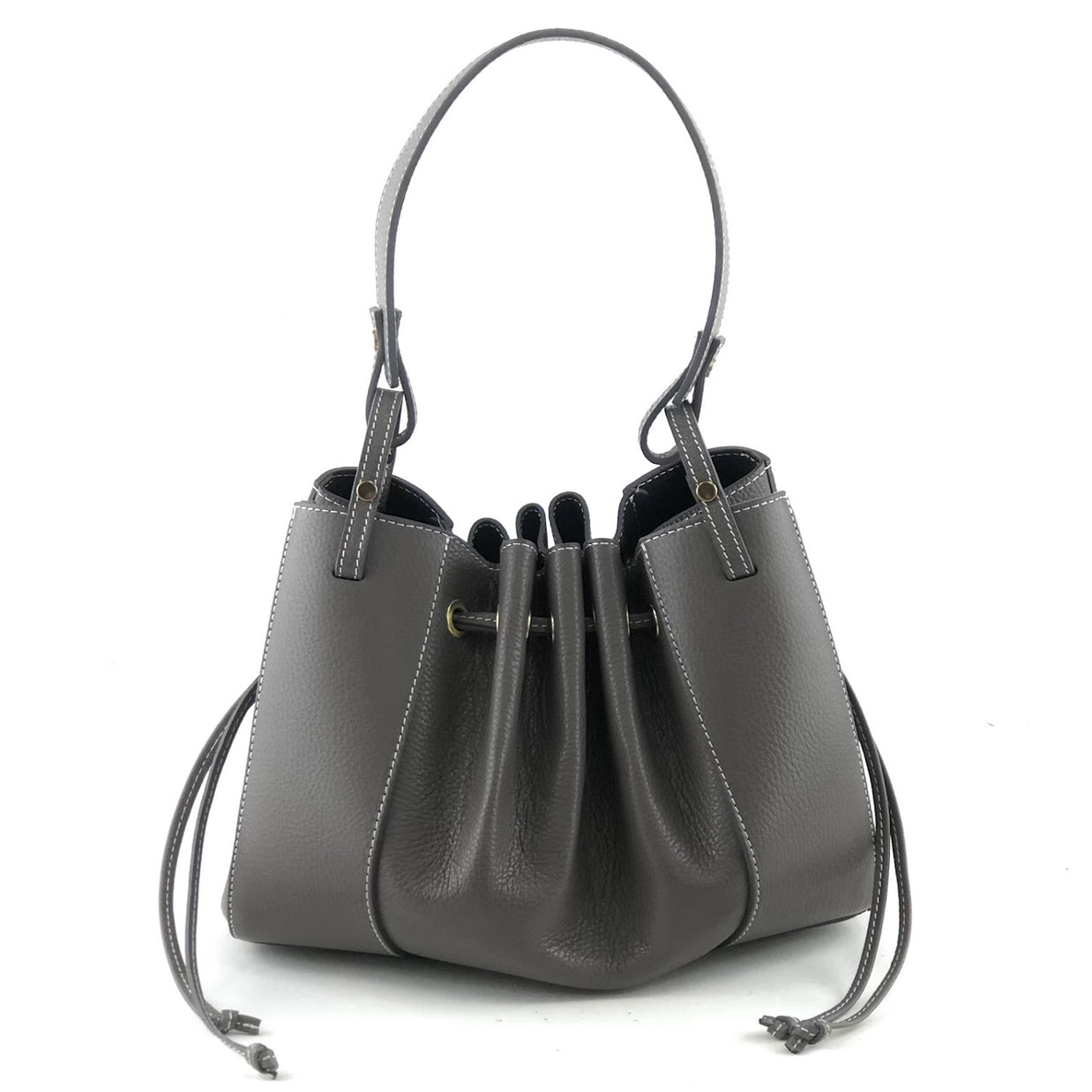 Charcoal gray pebbled leather drawstring bucket bag with contrast white stitching and adjustable shoulder strap