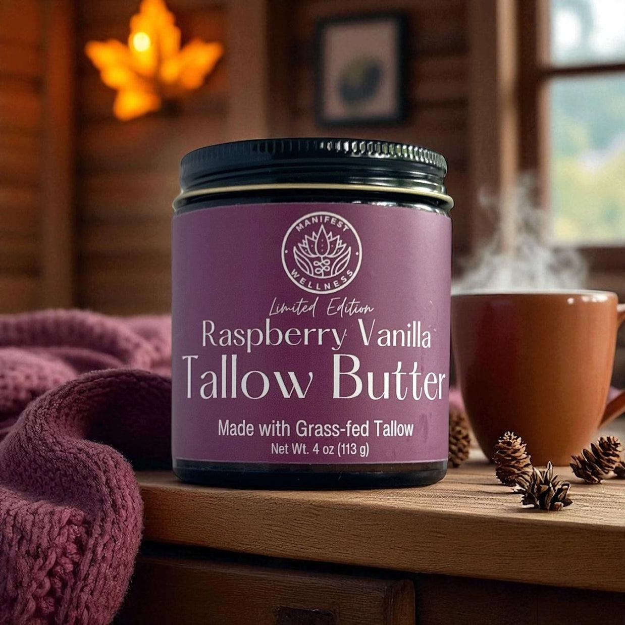 Jar of Raspberry Vanilla Tallow Butter on a wooden surface with a blurred background