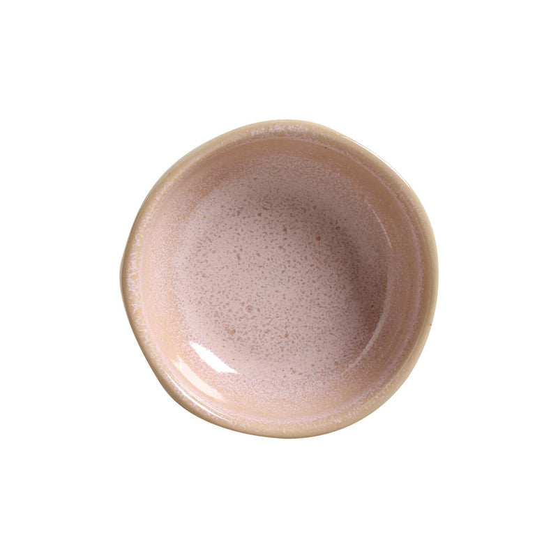 Handcrafted stoneware ramekin in dusty pink with speckled glaze finish and cream-colored rim, viewed from above