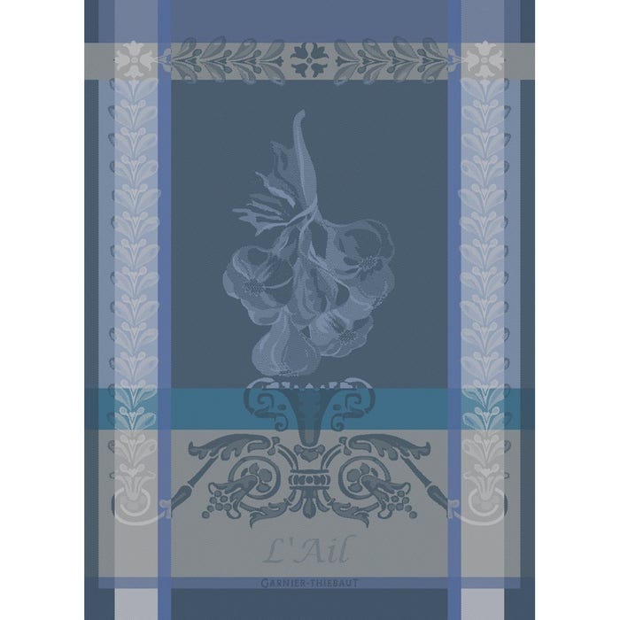 Blue and gray jacquard kitchen towel featuring garlic bulb motif with ornate botanical borders and decorative scrollwork