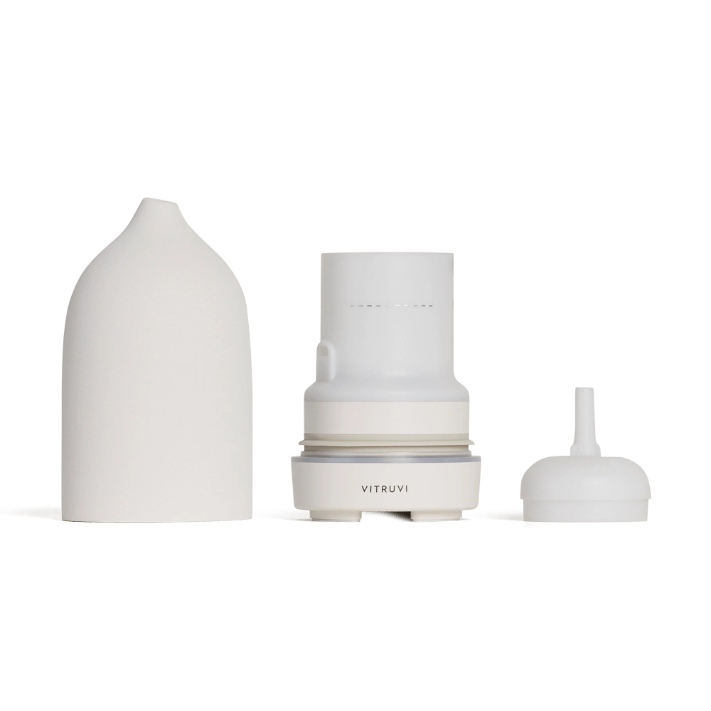 White water filtration system with dome cover, cylindrical filter cartridge, and dispensing nozzle in three separate pieces