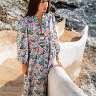 Flowing maxi caftan with pink paisley and emerald green floral print, balloon sleeves, multicolor striped trim detail