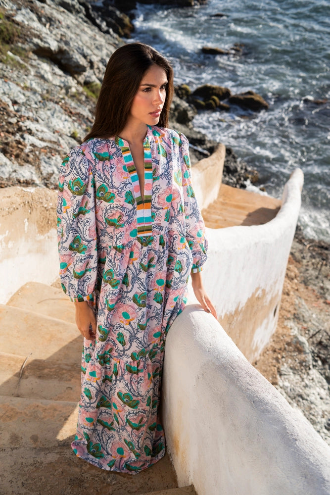 Flowing maxi caftan with pink paisley and emerald green floral print, balloon sleeves, multicolor striped trim detail