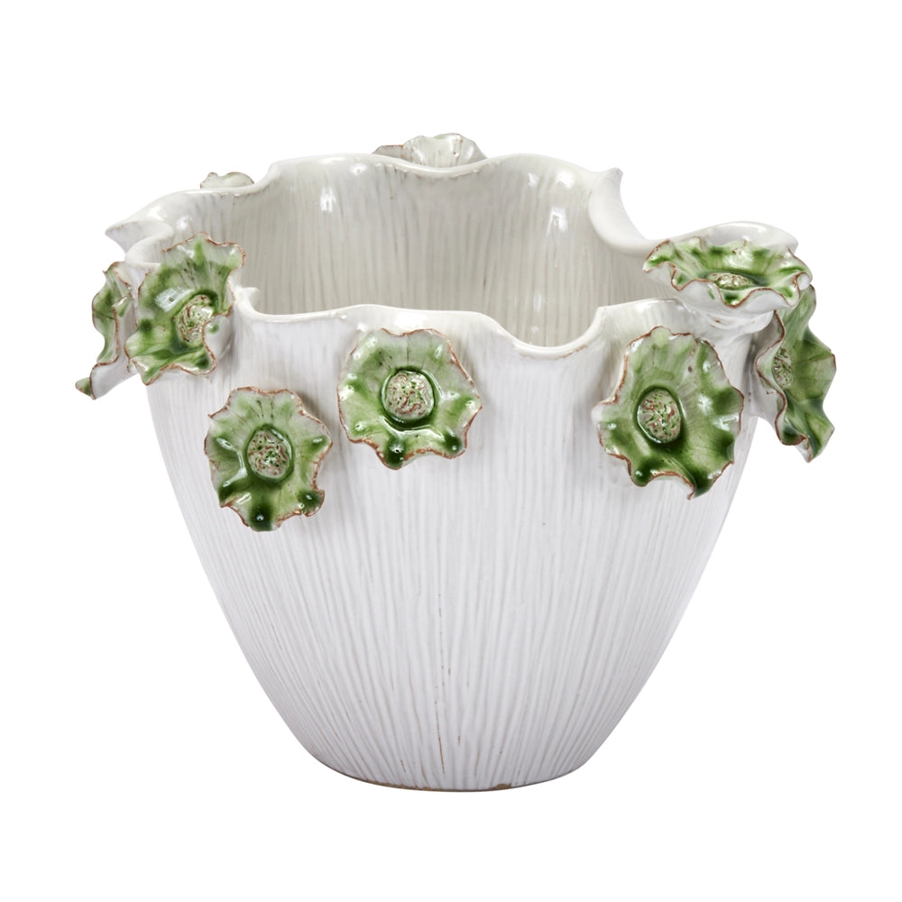 White ceramic vase with ruffled rim and textured vertical ridges, adorned with green lily flower appliqués and gold accents