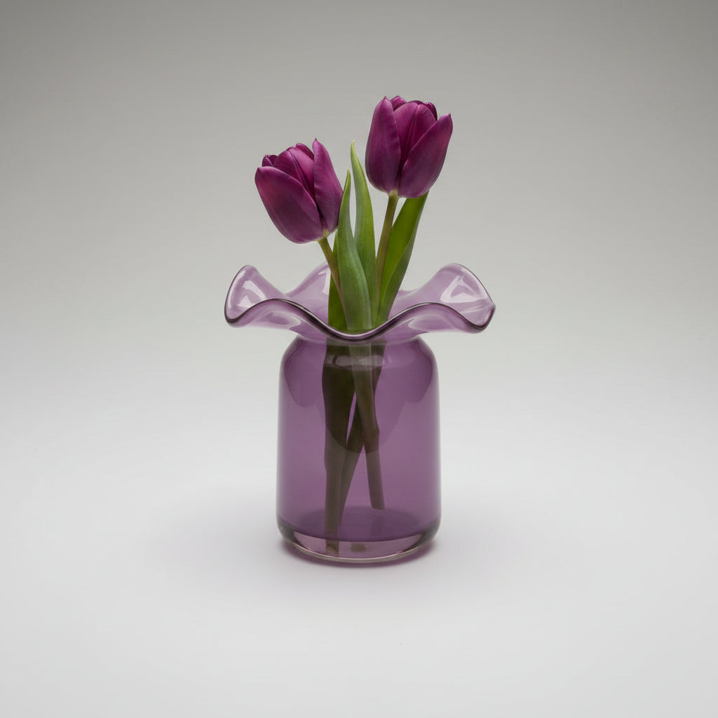 Lavender purple glass vase with ruffled wavy rim on cylindrical base with glossy translucent finish