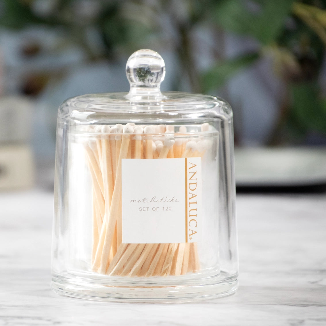 Clear glass apothecary jar with dome lid containing natural wood matchsticks, cream label reads Andaluca set of 120
