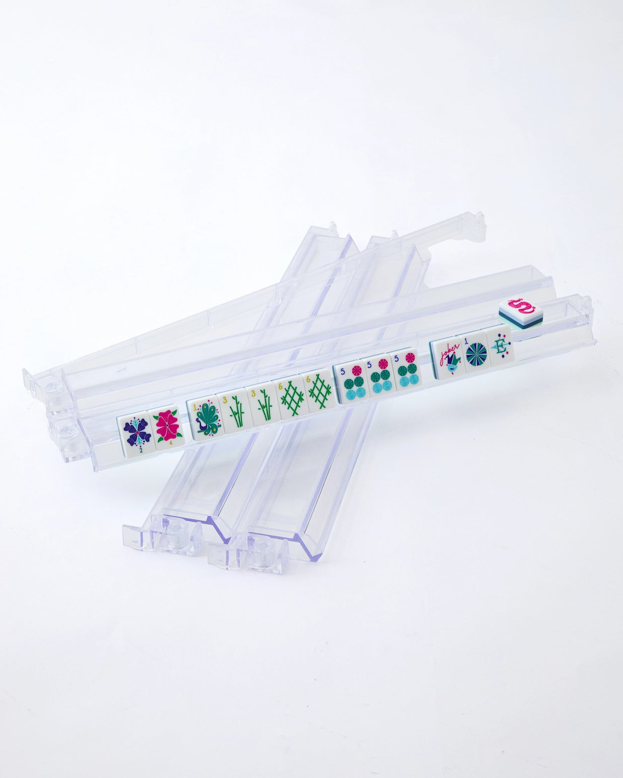 Clear acrylic mahjong tile rack holding colorful floral-patterned tiles with matching pusher tool displayed separately