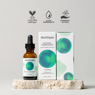 Amber glass dropper bottle with black cap and matching white box featuring watercolor teal and blue spheres on stone platform