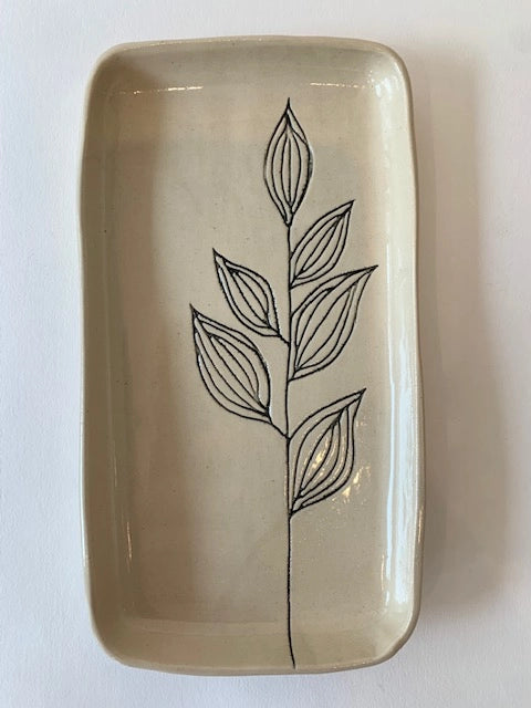 Rectangular cream ceramic tray with glossy finish and hand-drawn botanical leaf design in black line art
