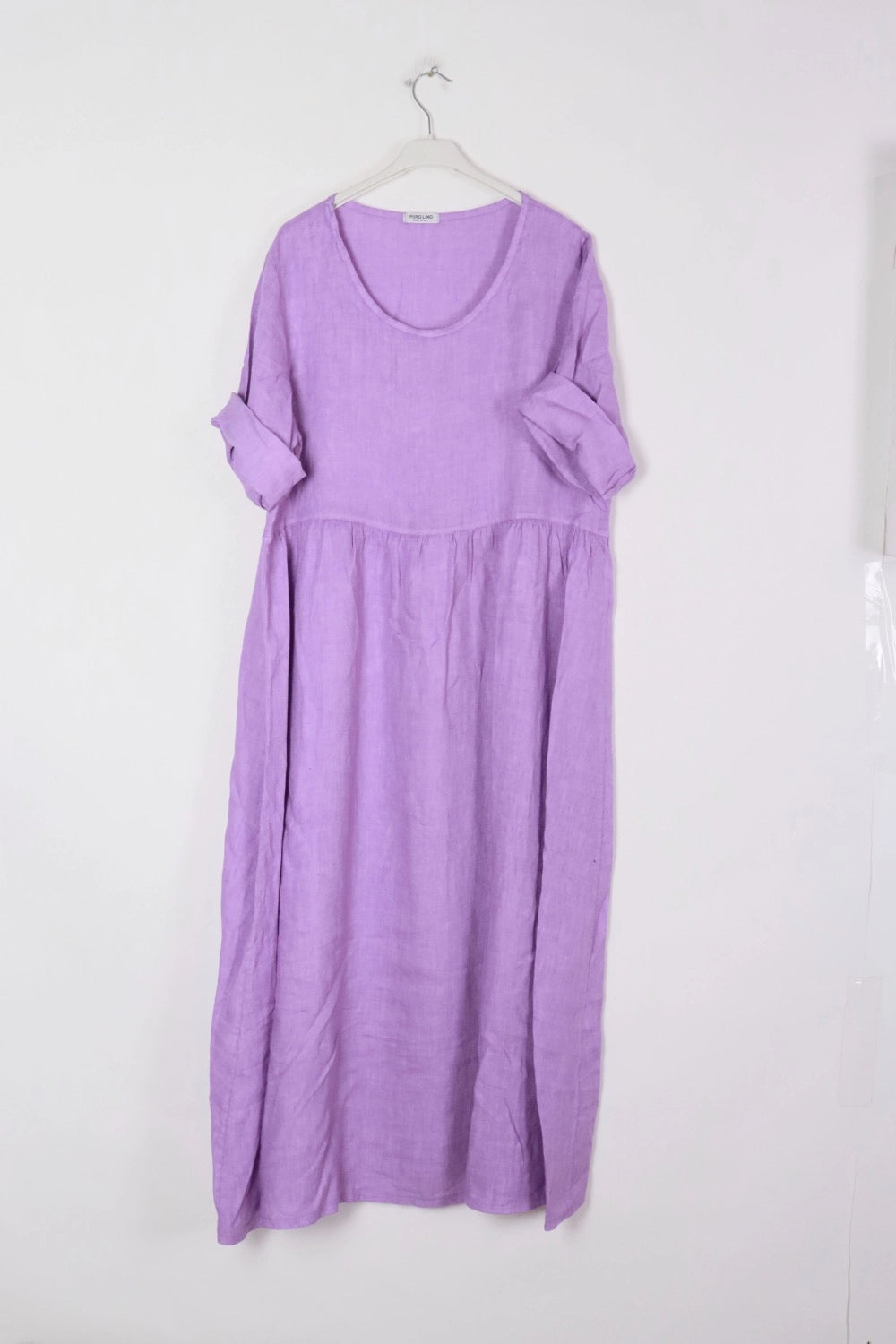 Lavender linen maxi dress with scoop neckline, rolled short sleeves, and gathered empire waist on white hanger