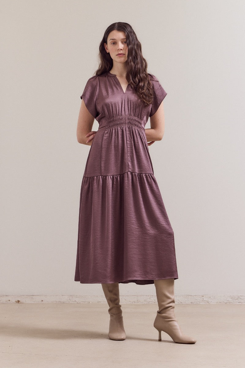 Mauve satin midi dress with short sleeves, V-neck, smocked elastic waist, and tiered ruffle skirt in lustrous fabric