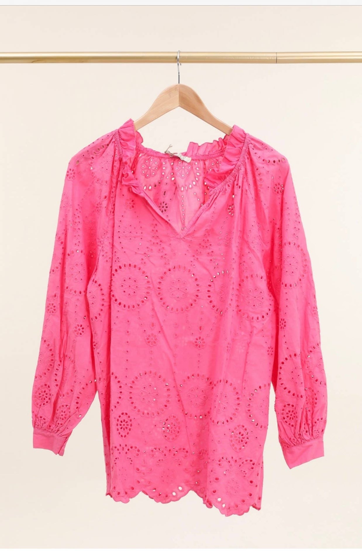 Bright pink cotton eyelet tunic with ruffled collar, long sleeves, and scalloped hem with circular cutwork embroidery