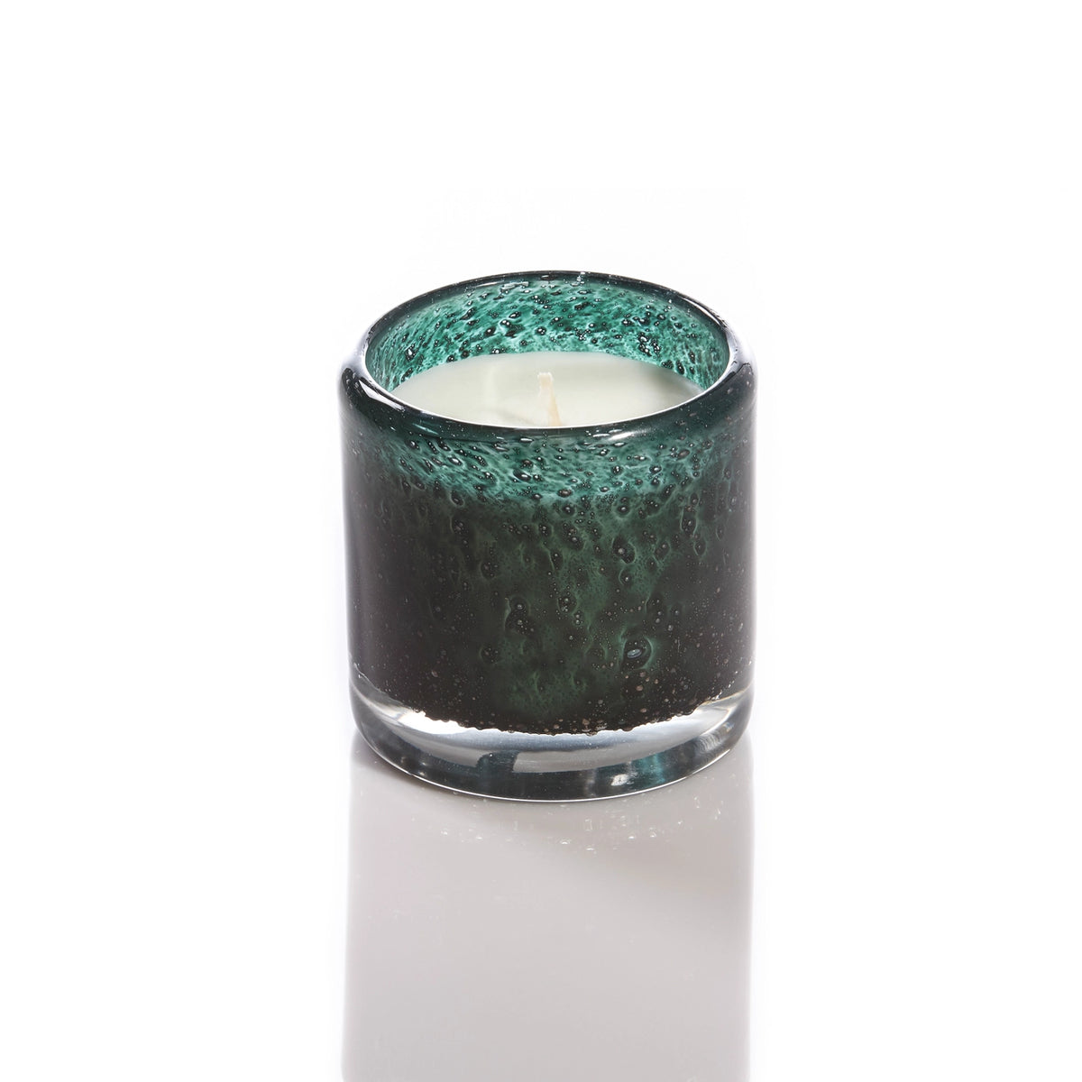 Dark teal textured glass candle with bubble detail, cream wax visible, cylindrical shape with clear glass base