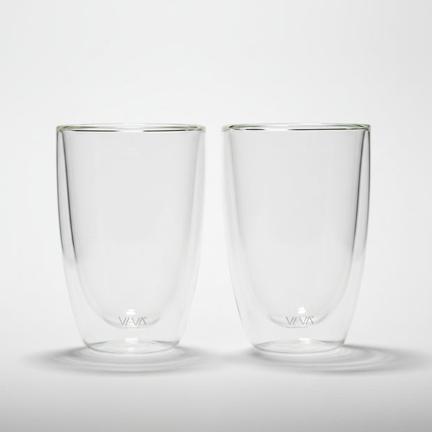 Two clear glass tumblers with a brand logo on a white background