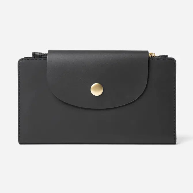 Black leather wallet with curved flap closure, gold dome snap button, and zip compartments on sides with gold hardware