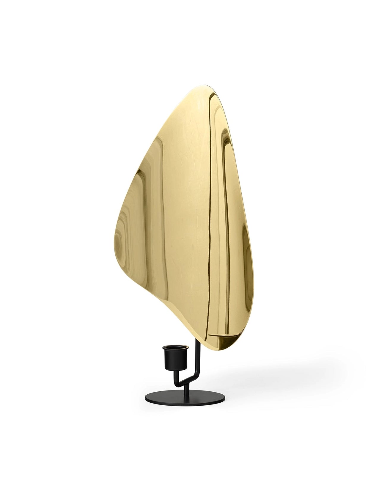 Polished brass triangular candle holder with curved organic shape on matte black metal stand with round base