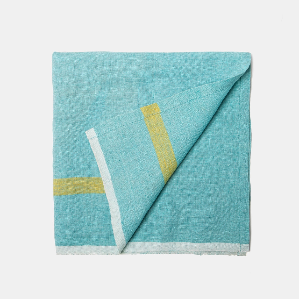Turquoise linen napkin with yellow and white striped border detail, folded diagonally showing textured weave fabric