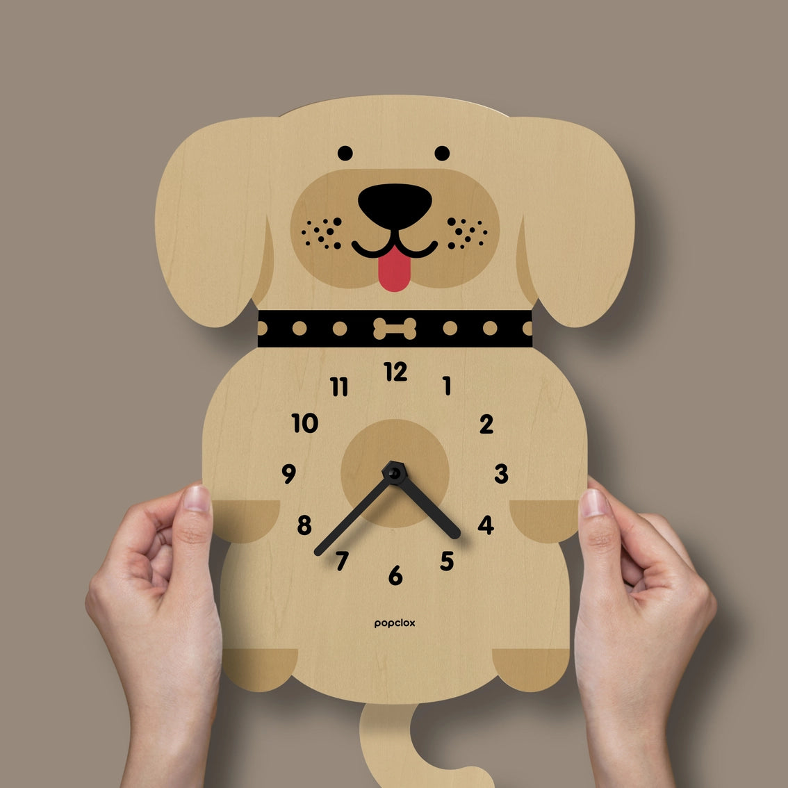 Wooden pendulum wall clock shaped like golden retriever with floppy ears, smiling face, black collar with bone detail