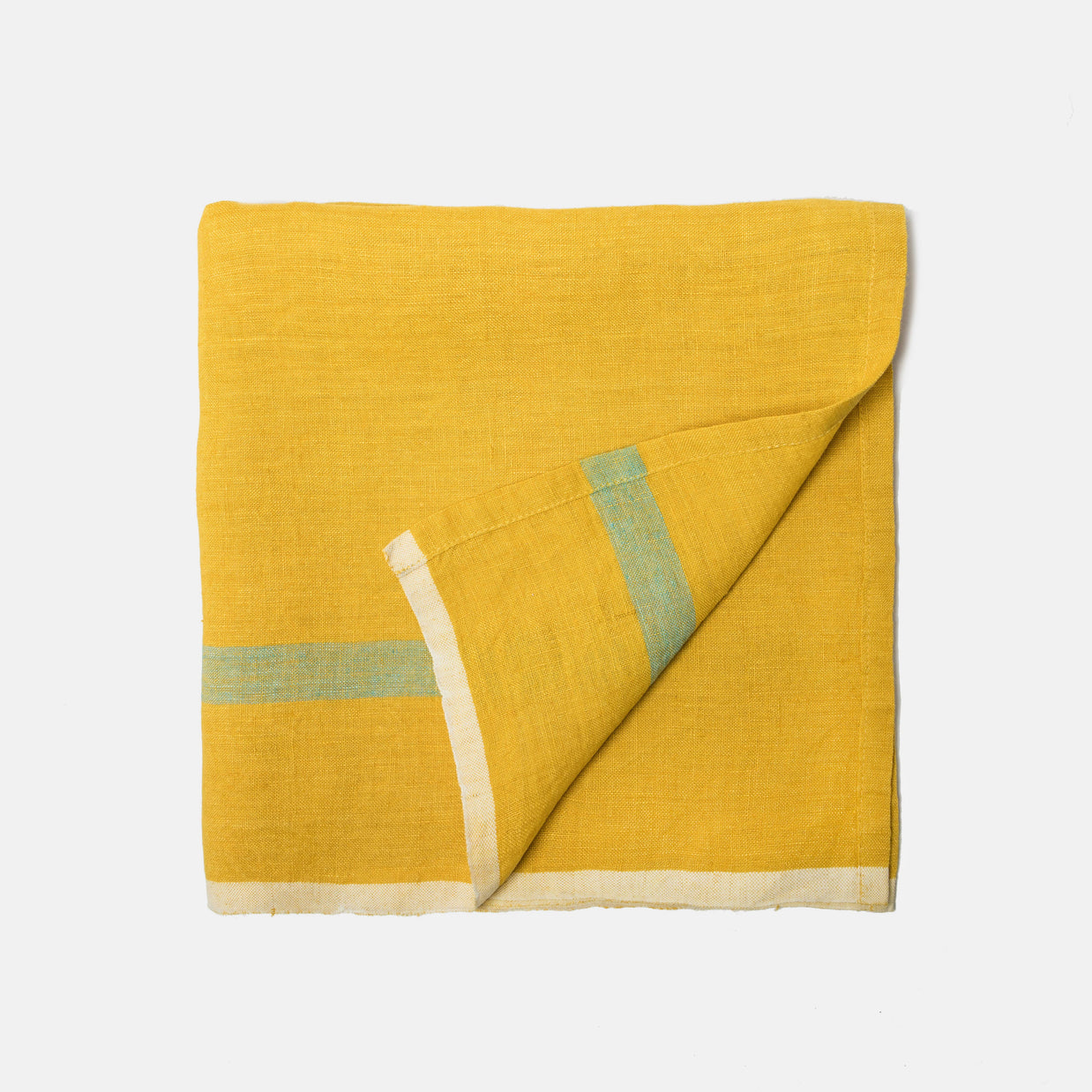 Golden yellow linen napkin with sage green and cream striped border, folded diagonally showing textured weave