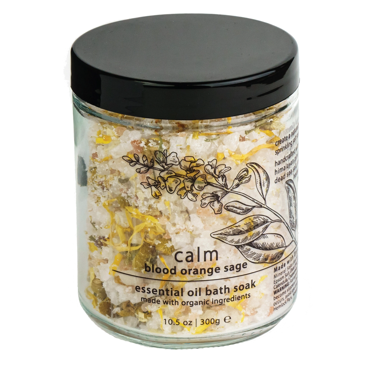 Glass jar of bath salts with white crystals, yellow flower petals, black lid, botanical illustration label reading calm