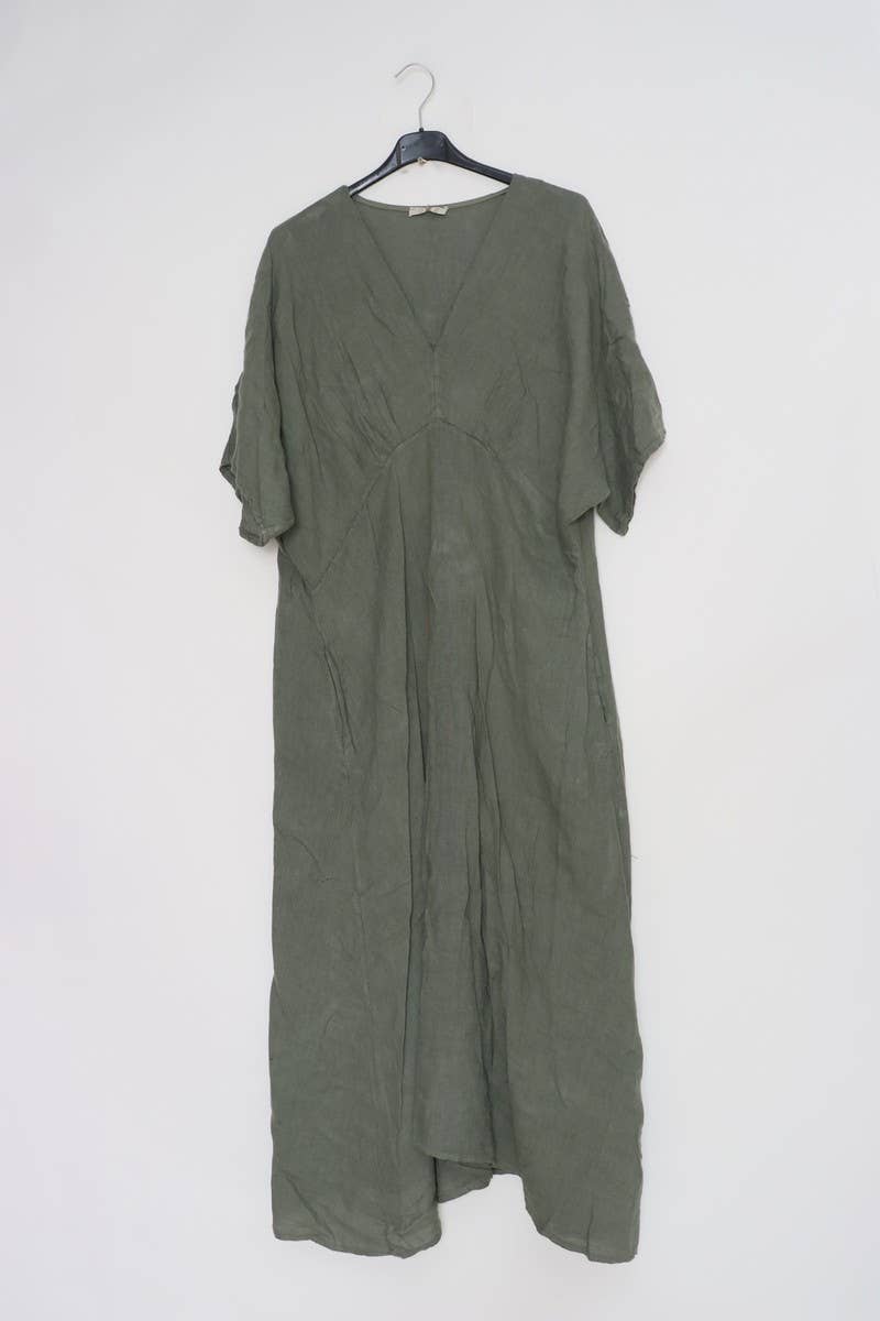 Sage green linen caftan dress with V-neck, rolled short sleeves, and loose flowing silhouette hanging on black hanger