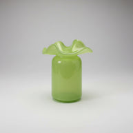 Chartreuse green glass vase with ruffled wavy rim, cylindrical body, and glossy finish with subtle speckled texture
