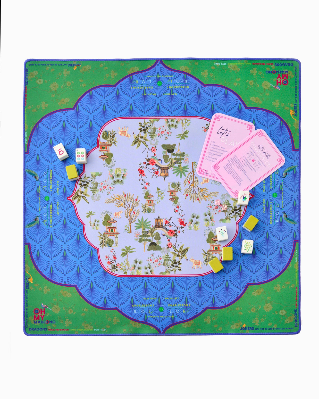 Mahjong game mat with blue scalloped border, green floral edges, chinoiserie center, pink instruction cards and tiles