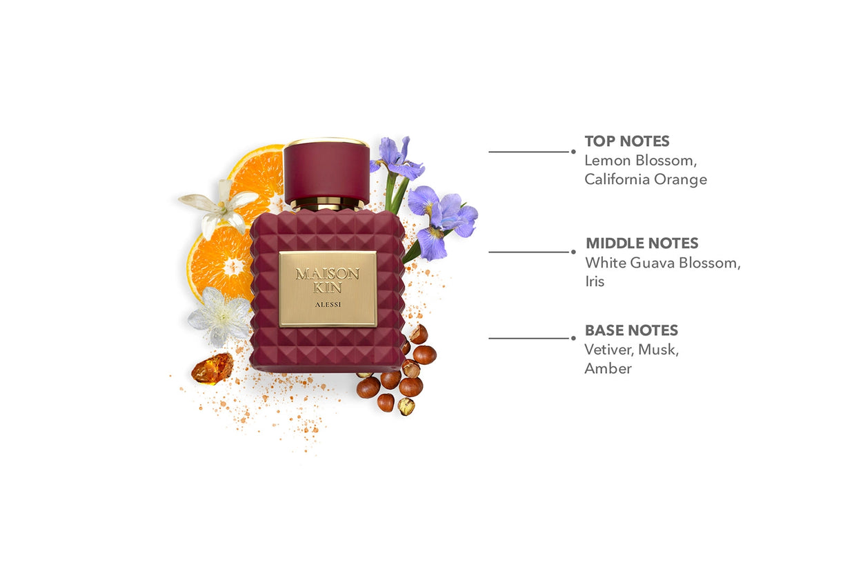 Maison Kin Alessi burgundy quilted glass perfume bottle with gold label surrounded by orange slices, iris flowers, and amber
