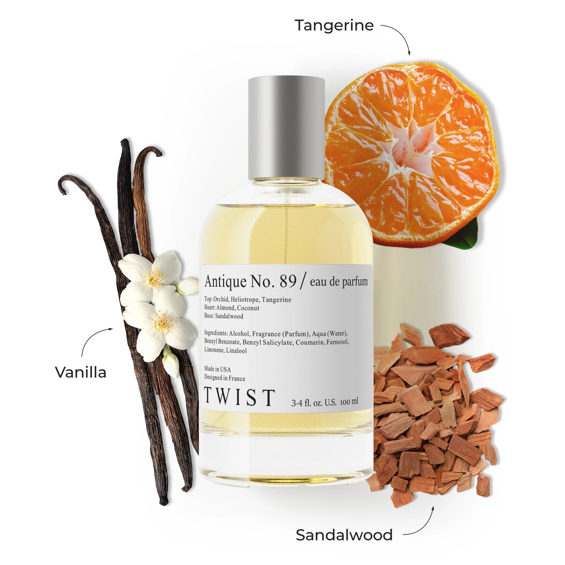 Clear glass perfume bottle with silver cap surrounded by vanilla beans, white orchid, tangerine slice, and sandalwood chips