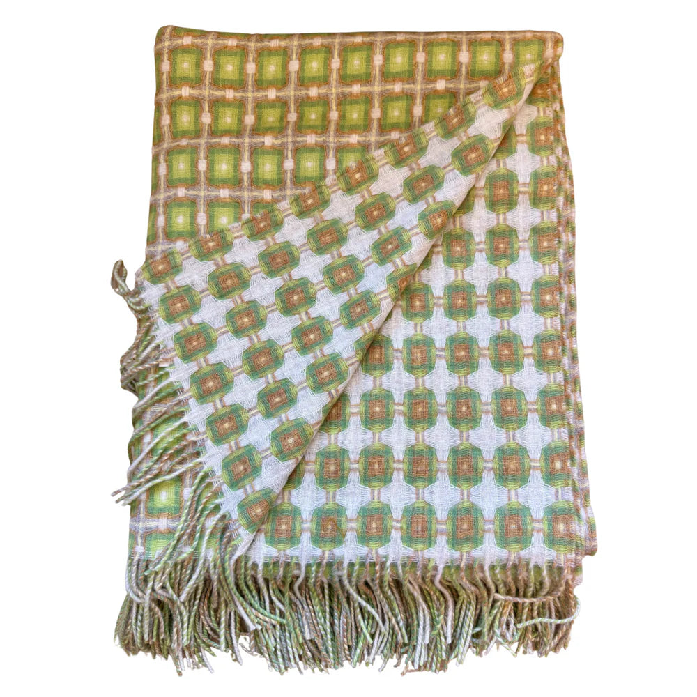 Woven throw blanket with retro geometric squares in olive green, tan, and cream with knotted fringe trim on edges