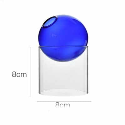 Cobalt blue glass sphere lid resting on clear square glass container with 8cm dimensions marked on white background