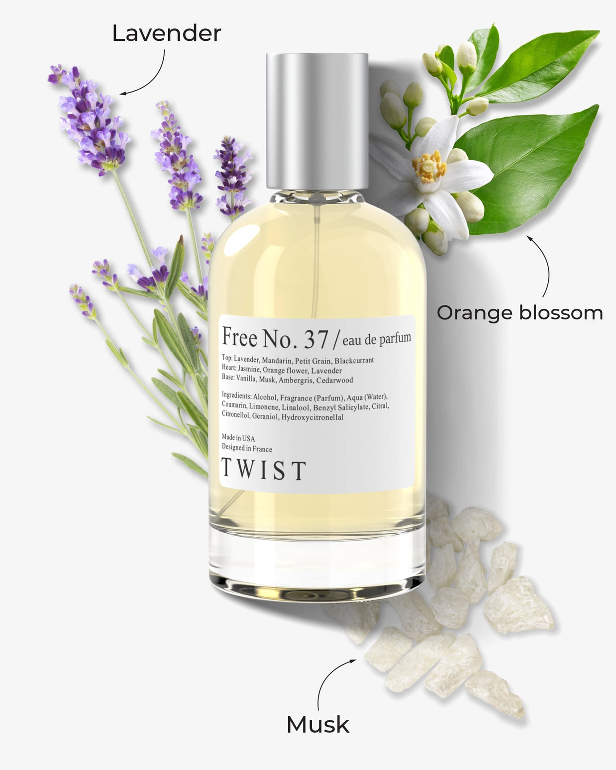 Clear glass perfume bottle with pale yellow liquid and silver cap surrounded by lavender sprigs, orange blossoms, and musk crystals