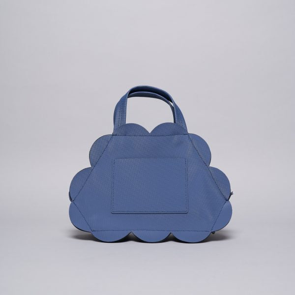 Periwinkle blue canvas tote bag with scalloped cloud-shaped edges and dual top handles on gray background