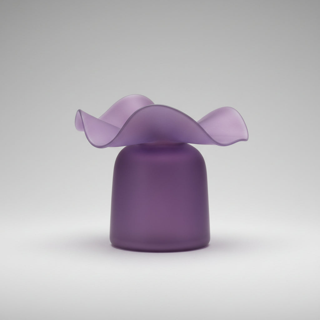 Glossy purple glass vase with smooth cylindrical base and wavy ruffled rim creating organic flower-petal shape