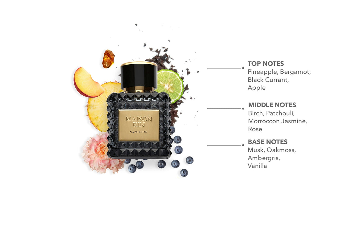 Maison Klin Napoleon perfume bottle with quilted black glass, gold label, surrounded by pineapple, berries, and rose