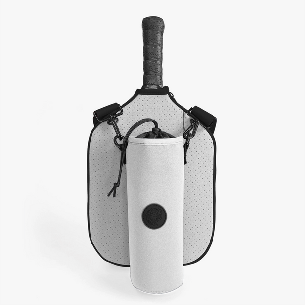 White perforated pickleball paddle bag with black trim and adjustable strap, featuring attached white water bottle holder