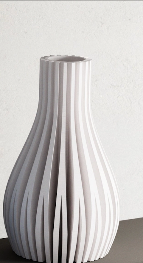 White ceramic vase with vertical pleated ridges creating sculptural teardrop silhouette on neutral background