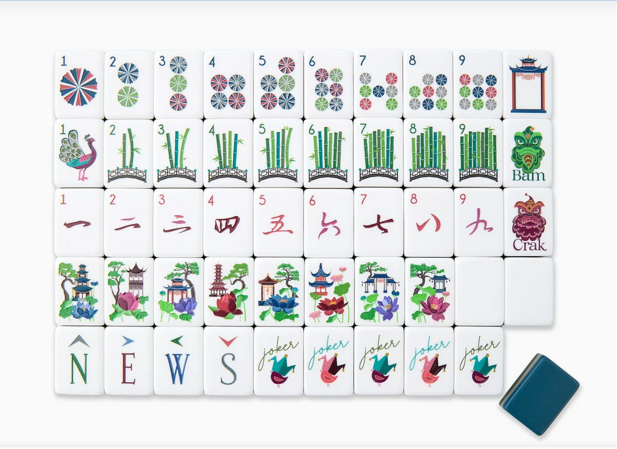 Mahjong tile set with colorful Asian-inspired designs including bamboo stalks, lotus flowers, pagodas, and decorative wheels on white tiles