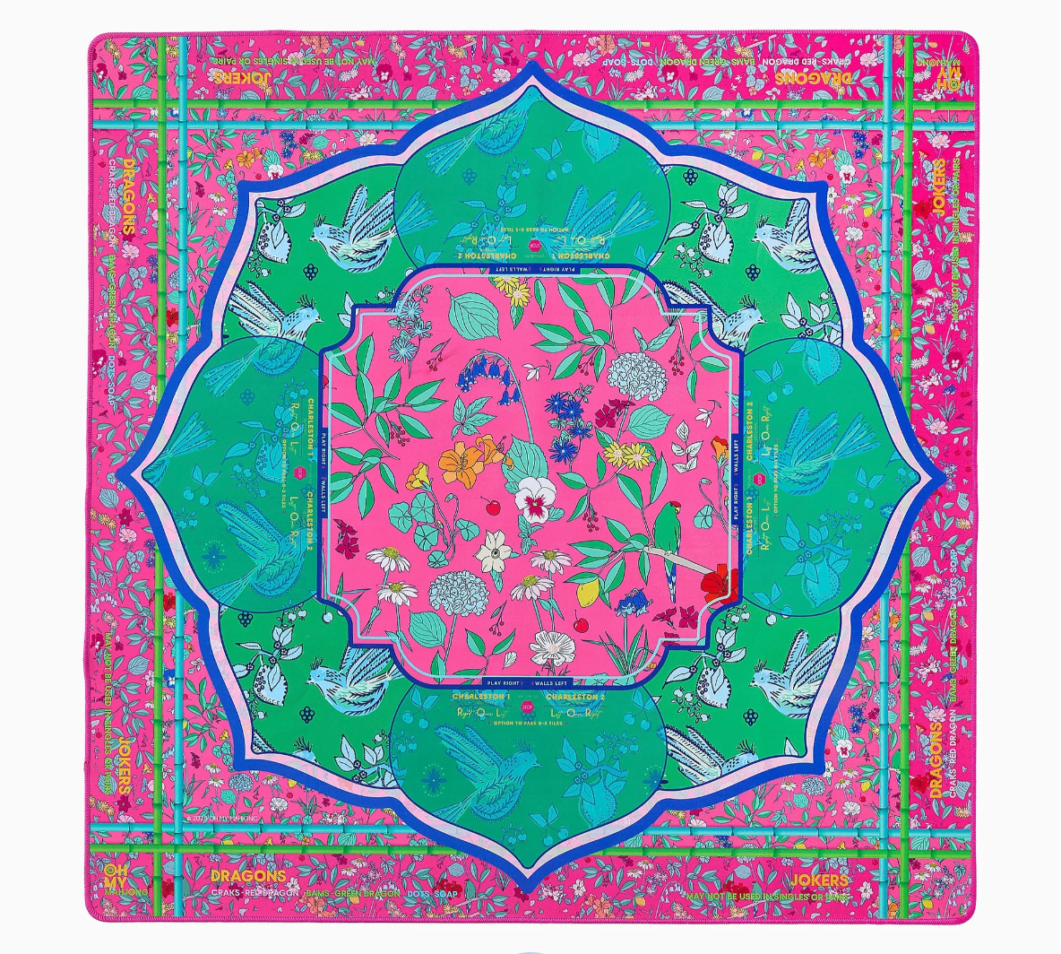 Vibrant pink and green mahjong mat featuring botanical floral pattern with birds, centered design with game position labels