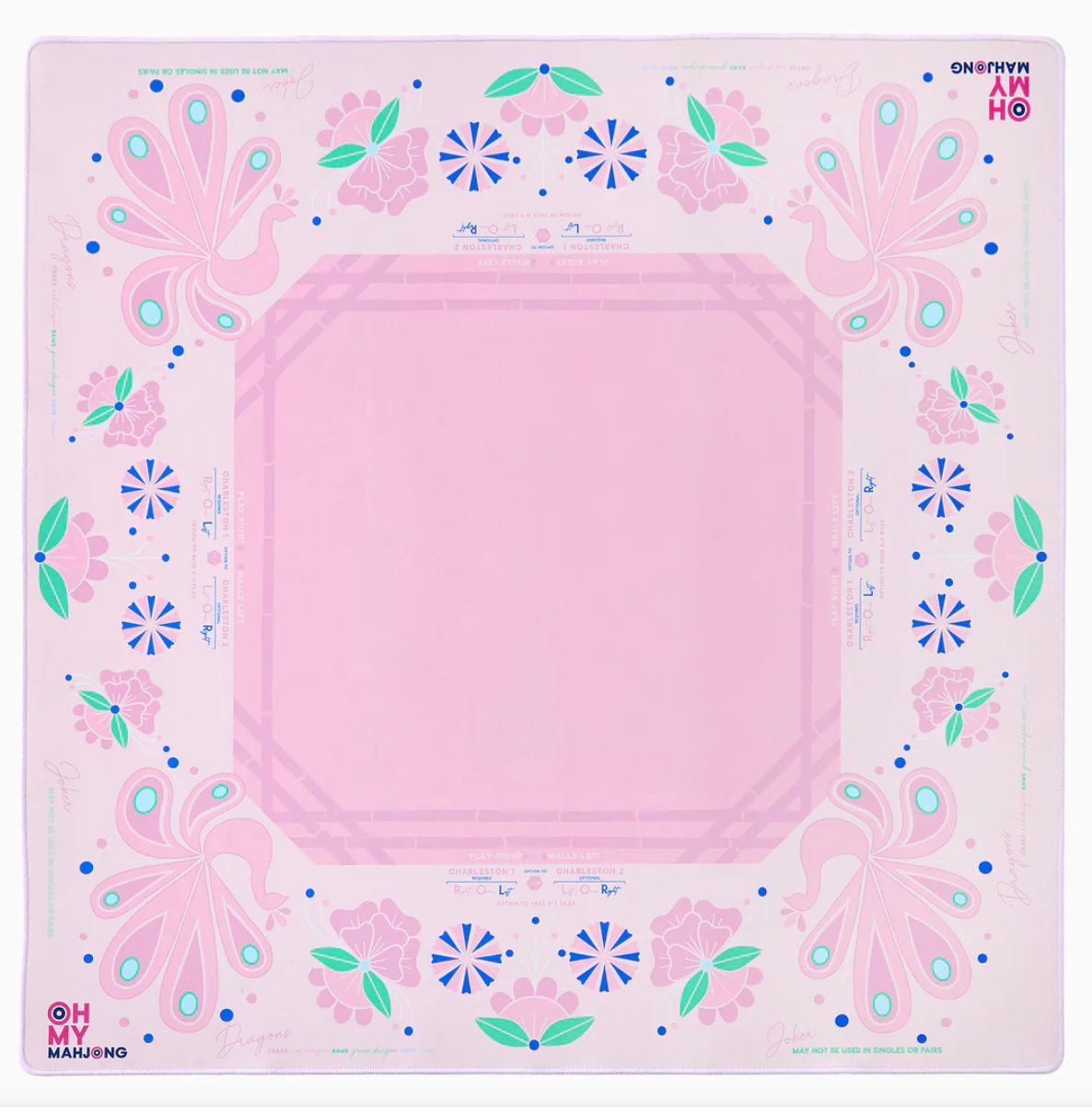 Pink mahjong mat with peacock and floral pattern featuring turquoise accents, blue starbursts, and green leaves on pale pink border