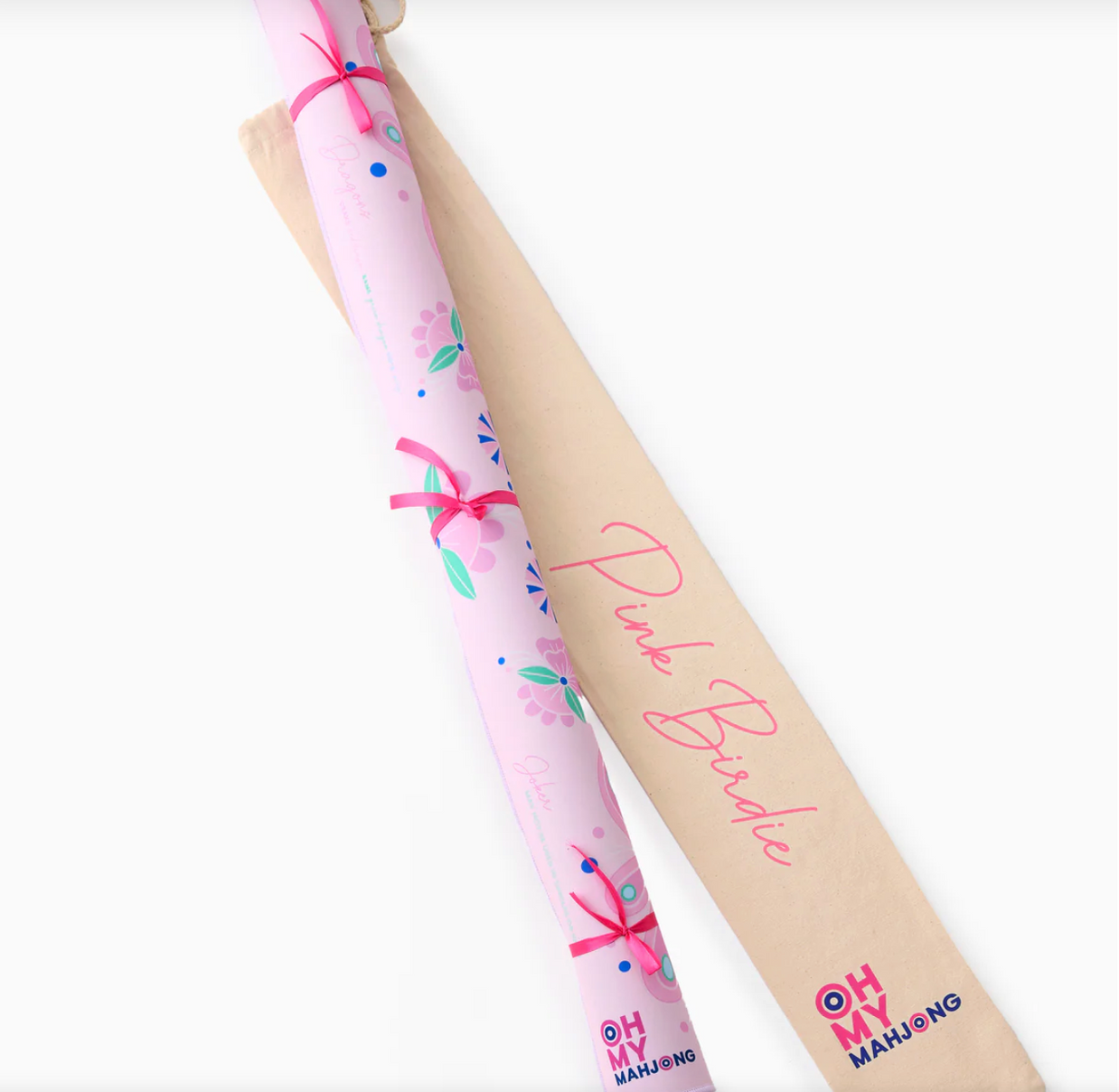 Pink floral patterned rolled paper with pink ribbon ties displayed on natural kraft cardboard tube labeled Pink Fringe