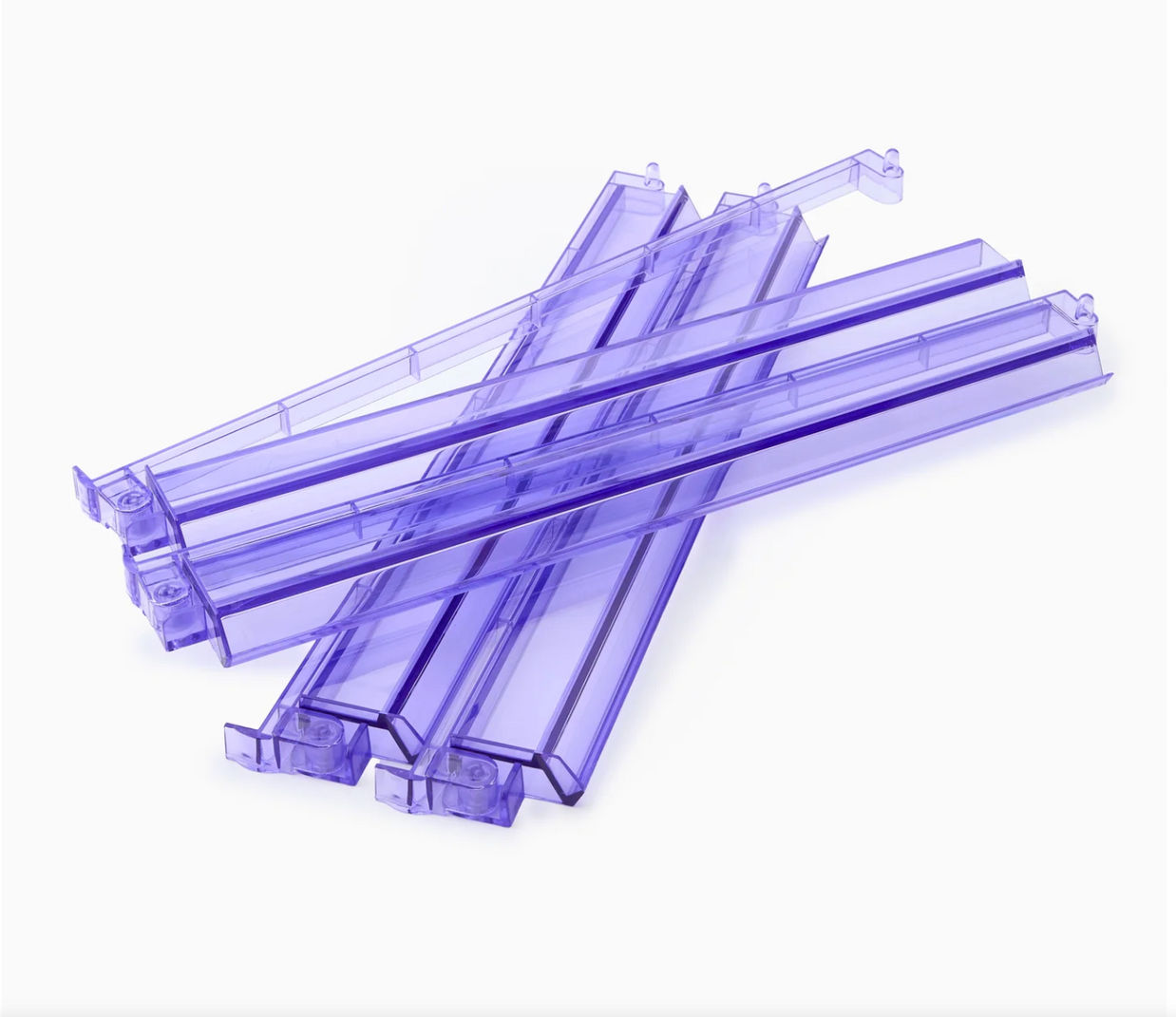 Translucent purple acrylic drawer dividers with U-shaped channels and interlocking tabs arranged in overlapping stack