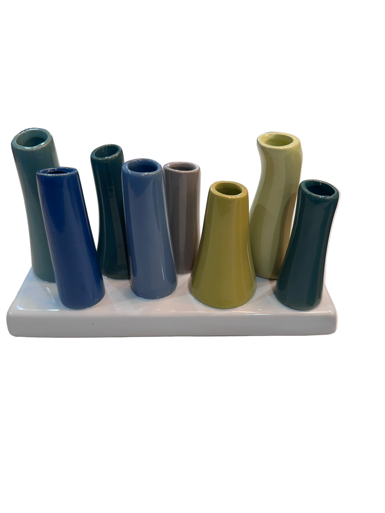 Ceramic multi-tube vase with nine cylindrical stems in teal, navy, olive, and taupe glazes on white rectangular base
